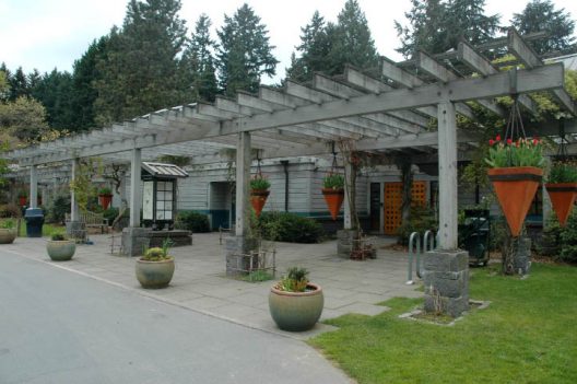 building with pergola and planted containers