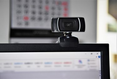 web camera attached to the top of a computer screen.