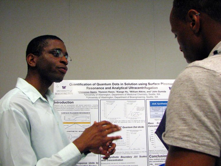 Student presenting at poster session