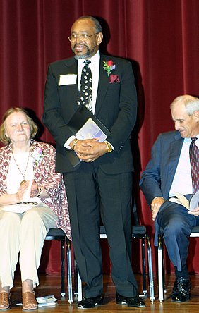 Emile standing to receive the Brotman Awards