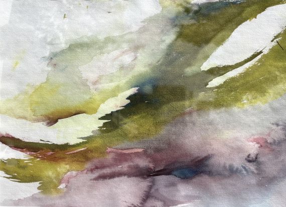 Purple and olive green watercolor splashes on paper