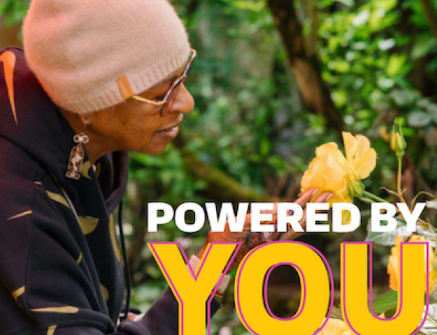 Woman smelling a yellow rose