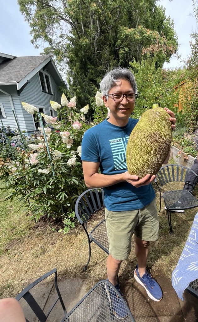 Professor Imaizumi poses with a jackfruit.