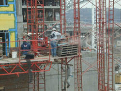 image of a construction worker on site full with dust around