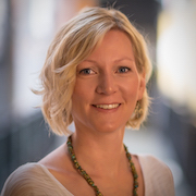 Blonde woman looking at the camera.