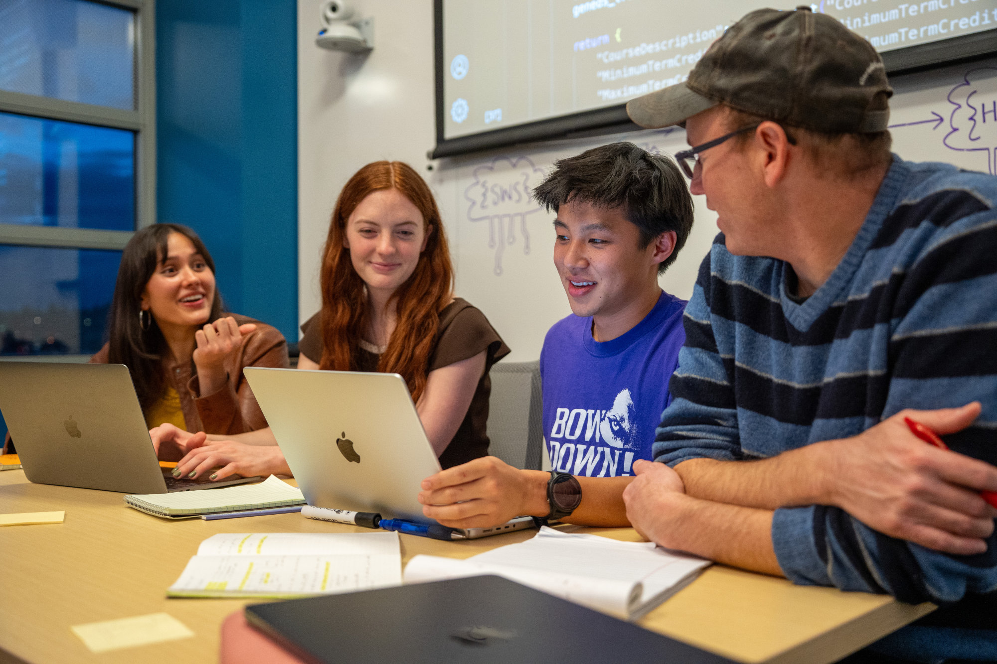 Three students working together at desk