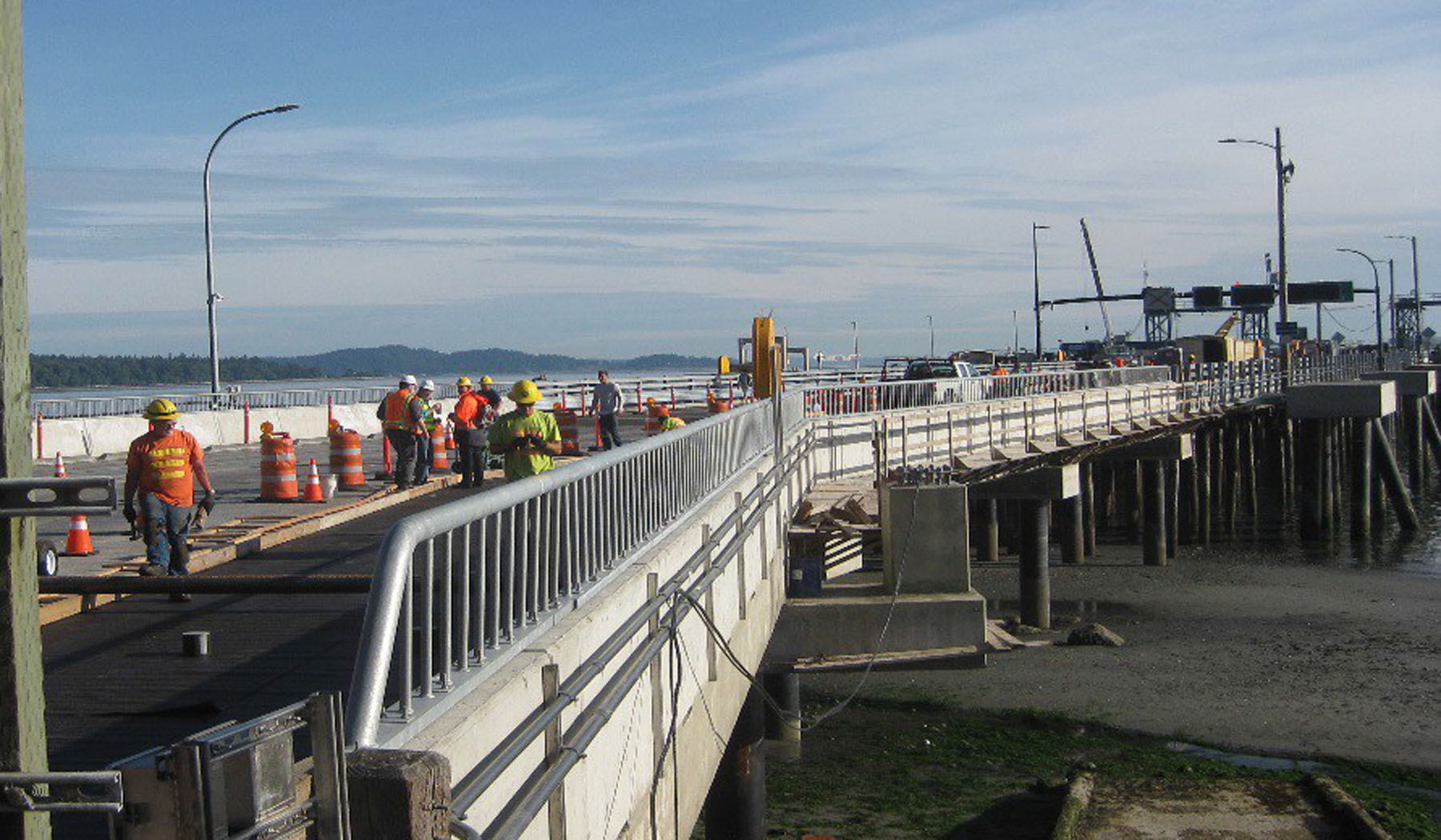 Workers constructing a new ferry terminal car ramp