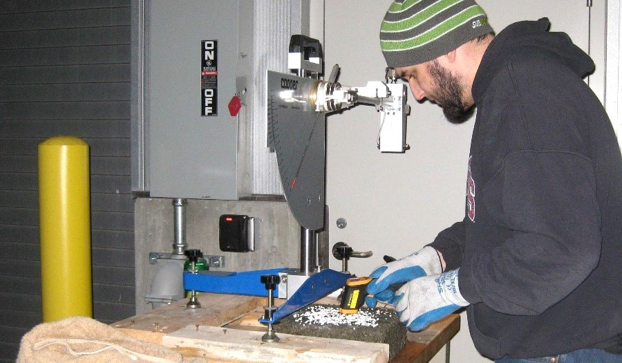 Researcher testing pavement marking materials in the laboratory