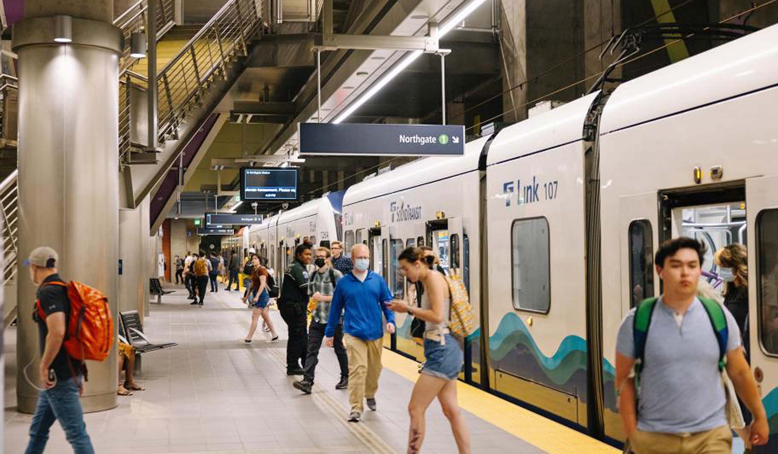 Transit riders in a Link light rail station in Seattle.