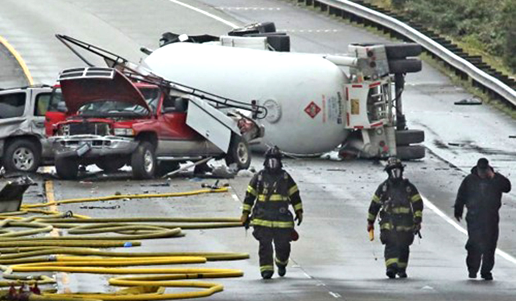 Fire fighters work the scene of a tanker collision in Seattle