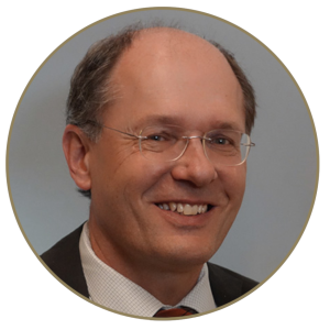 Circular Headshot of Jurgen Unutzer, smiling, Professor and Chair Psychiatry and Behavioral Sciences