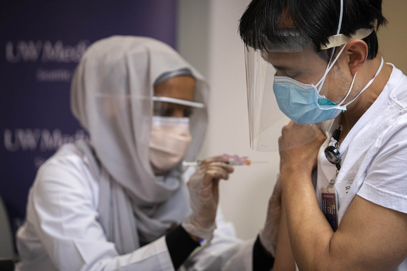 UW Medicine nurse providing a vaccine injection.