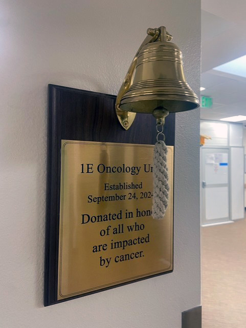 the brass bell hanging in the 1E concology unit. This is the bell patients ring when they are cancer-free.