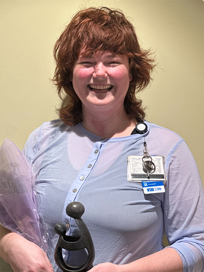 Alice Howey holding her award