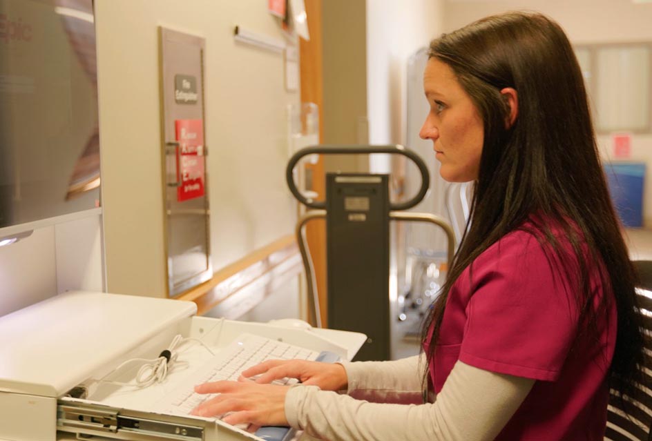 a nurse at a workstation