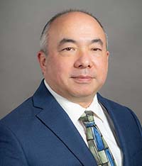 headshot of Eric Higashi