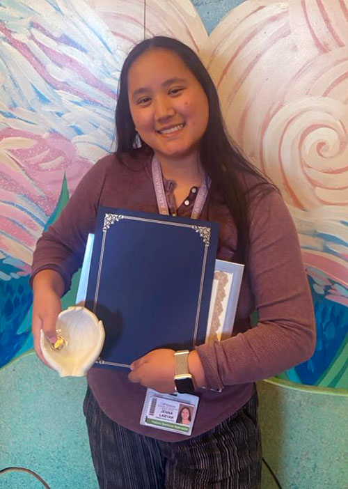 Jenna Labyak holding her award