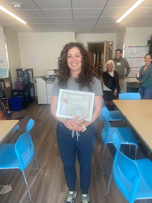 Katie Sweet holding her award