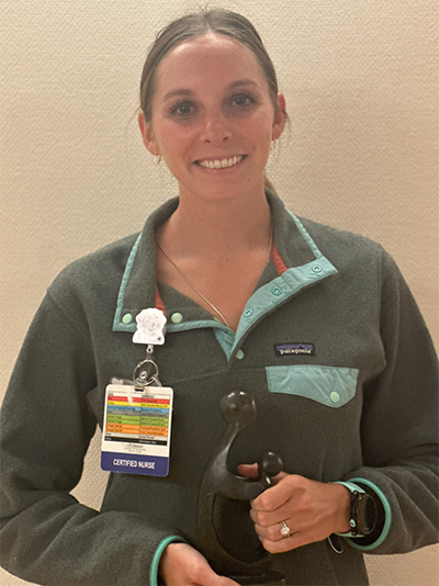 Katryna Mugan holding her award