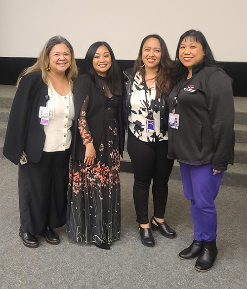 Nancy Colobong Smith posing with a group