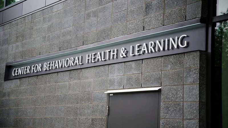 Closeup of an exterior sign reading Center for Behavioral Health and Learning